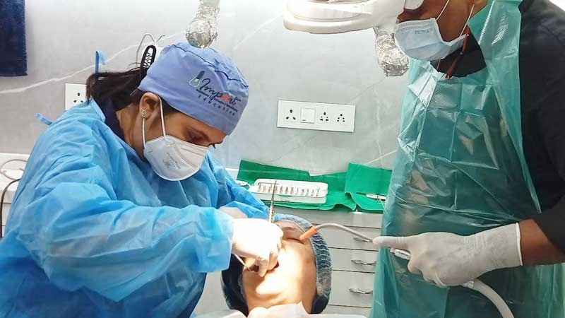 Dr. Chaitali performing Dental implant procedure at The Smile Spa Dental Clinic located in Juhu
                        